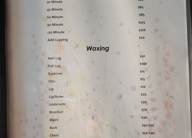 Service menu at Massage with Liz, LLC in Springfield, Oregon, US offering massage and waxing options.
