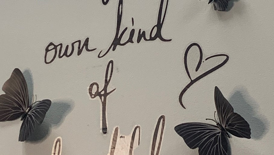 Inspirational wall art with butterflies at Glamazon Salon, Nassau, New Providence, BS, promoting self-love.