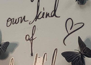 Inspirational wall art with butterflies at Glamazon Salon, Nassau, New Providence, BS, promoting self-love.