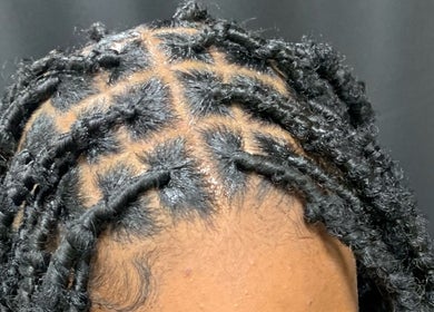 Close-up of intricate braiding at Glamazon Salon in Nassau, New Providence, BS, showcasing detailed hair artistry.