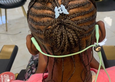 Intricate braided hairstyle at Glamazon Salon in Nassau, New Providence, BS, showcasing expert styling.