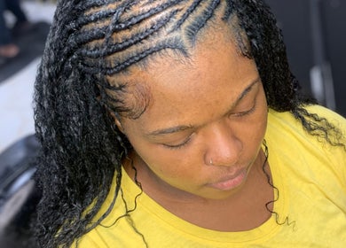 Braided hairstyle at Glamazon Salon, Nassau, New Providence, BS. Showcasing intricate cornrows.