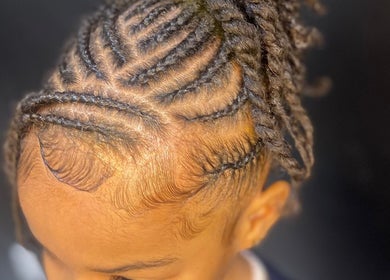 Intricate braid hairstyle at Glamazon Salon, Nassau, New Providence, BS, showcasing expert styling.