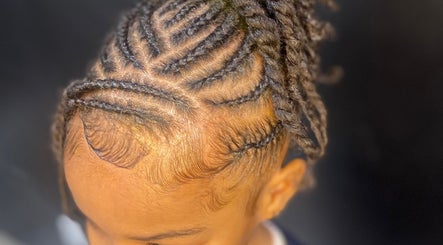 Intricate braid hairstyle at Glamazon Salon, Nassau, New Providence, BS, showcasing expert styling.