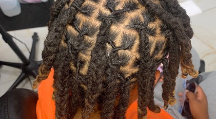 Intricate dreadlock styling at Glamazon Salon, Nassau, New Providence, BS, showcasing expert craftsmanship.