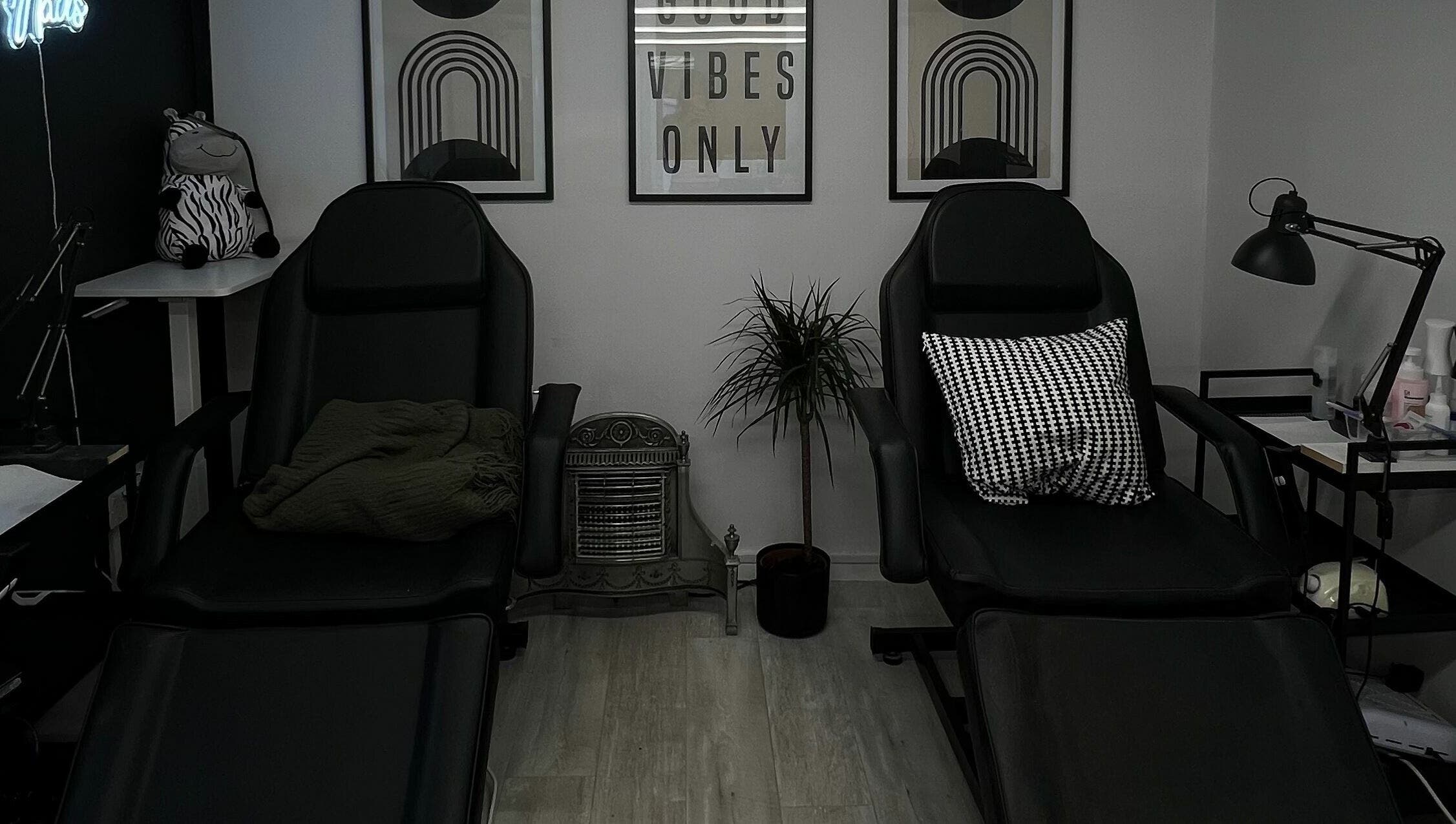 Relaxing lounge area at Point G, London, England, GB with stylish chairs and decor.