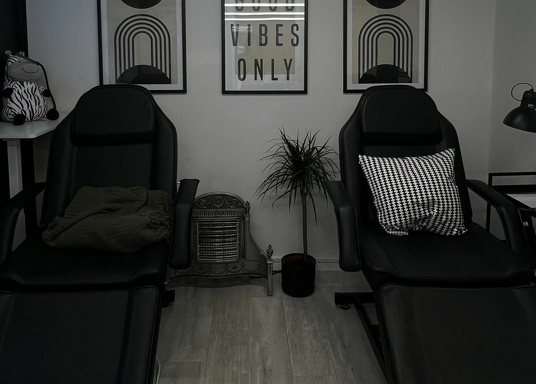 Relaxing lounge area at Point G, London, England, GB with stylish chairs and decor.