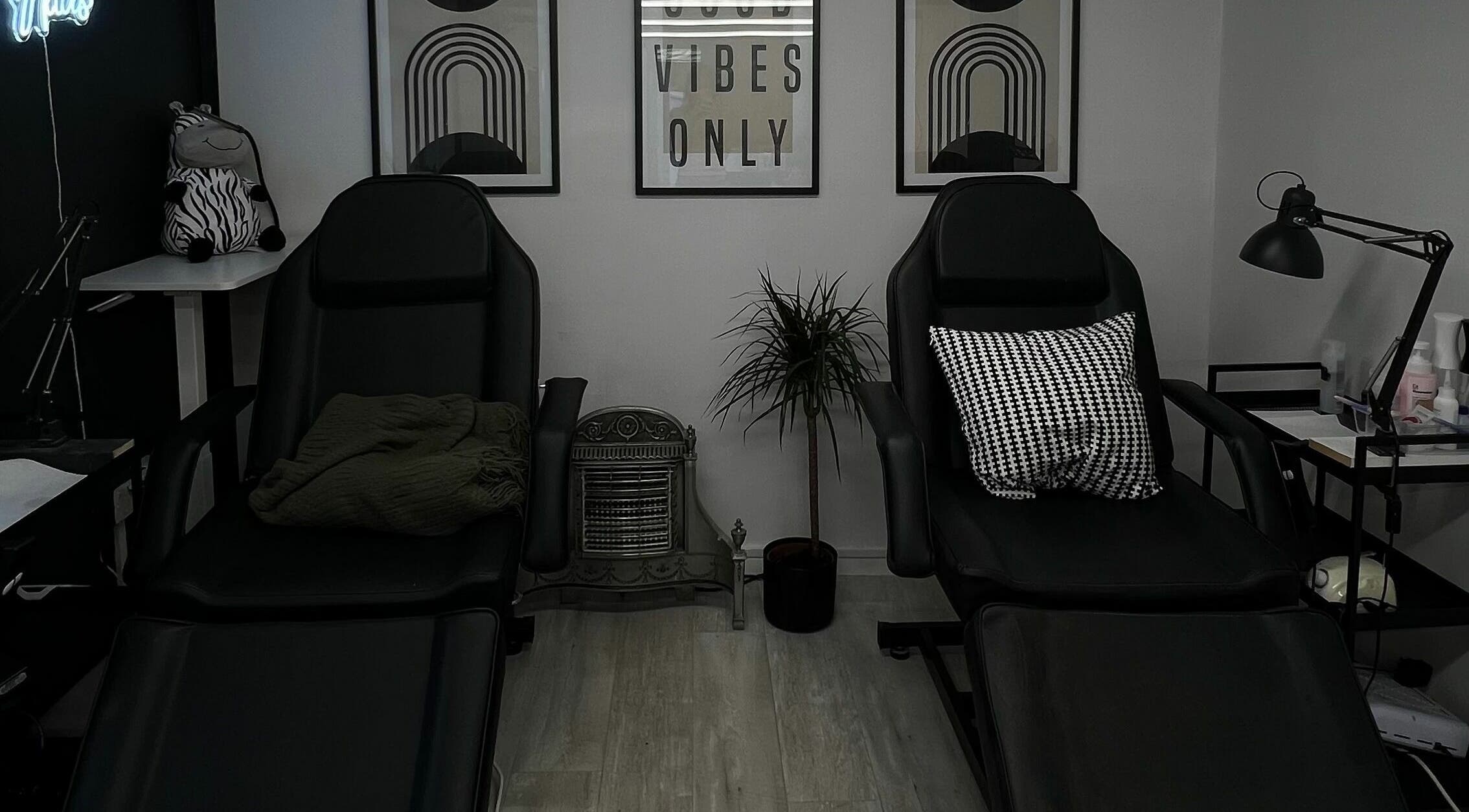 Relaxing lounge area at Point G, London, England, GB with stylish chairs and decor.