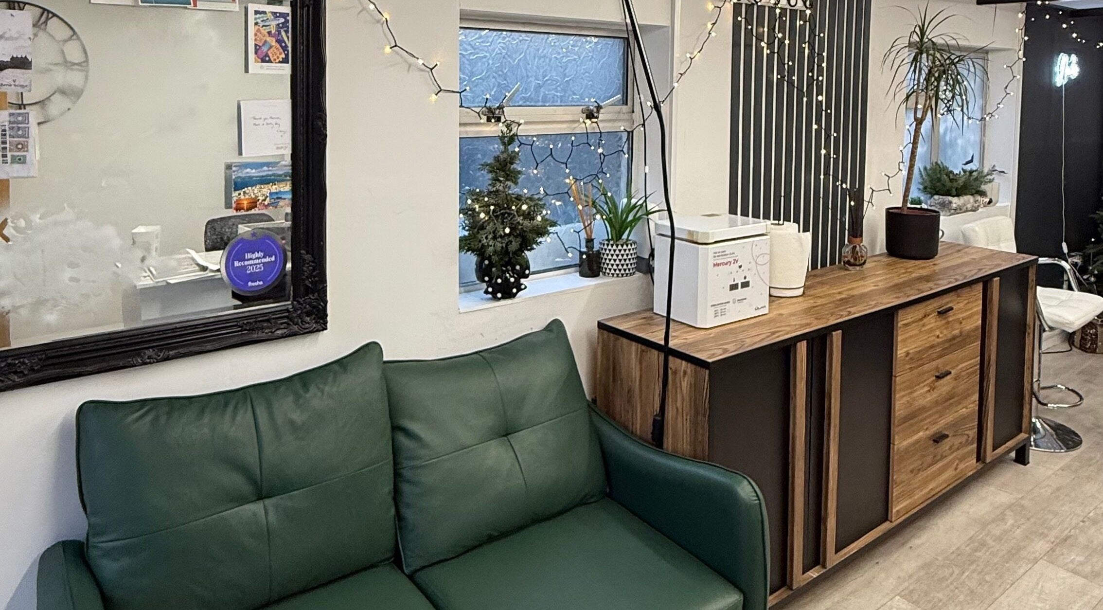 Inviting green sofa and decor at Point G, a beauty venue in London, England, GB, showcasing a stylish interior.