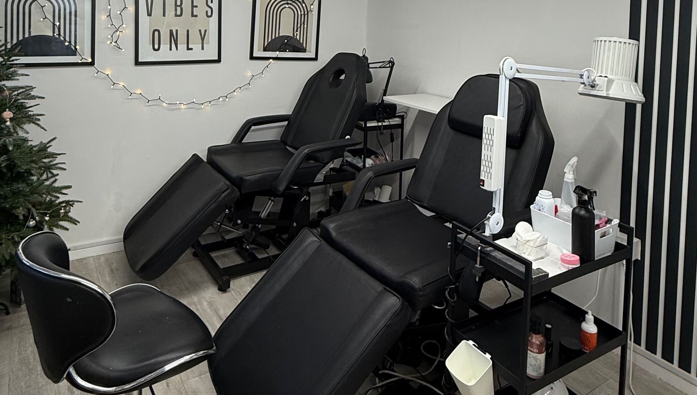 Relaxing treatment room at Point G, London, England, GB featuring plush chairs and soothing decor.
