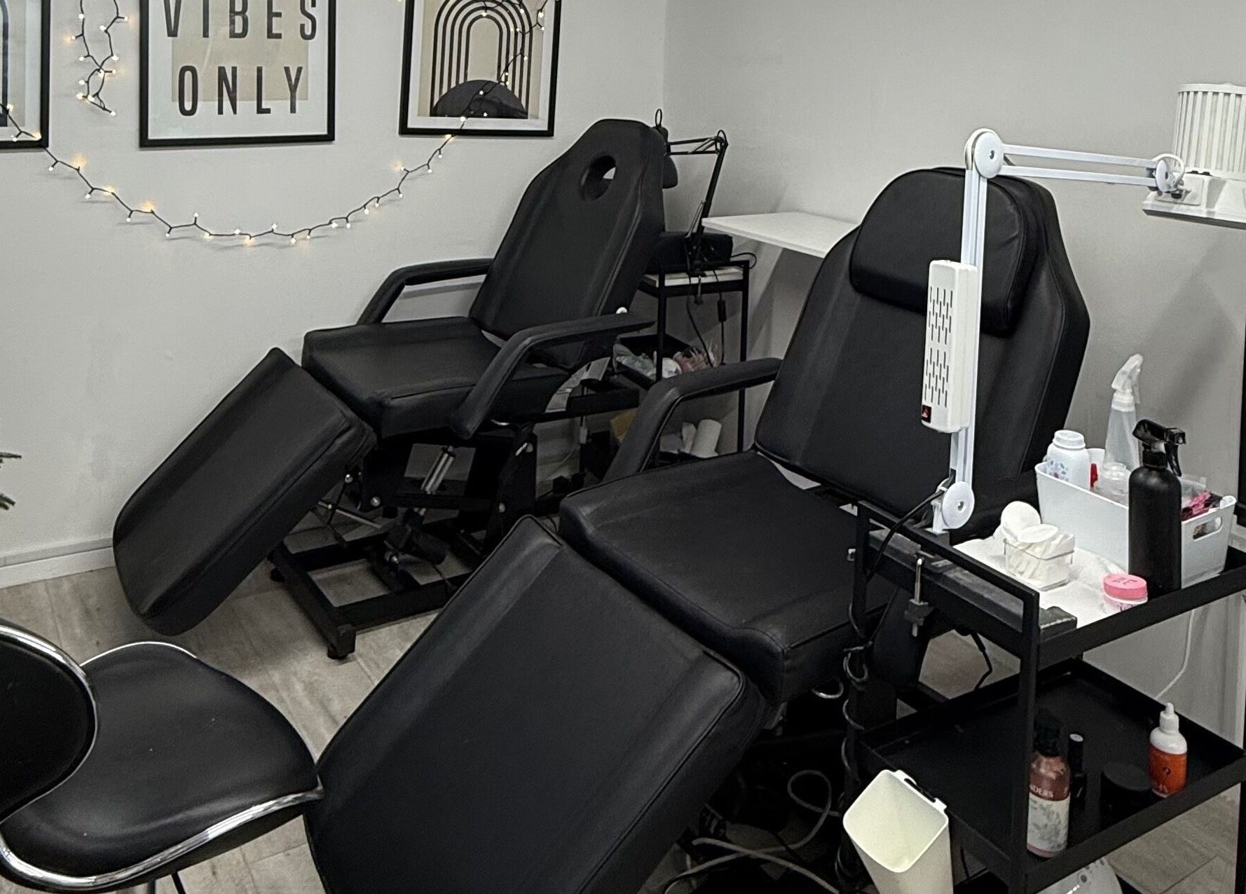 Relaxing treatment room at Point G, London, England, GB featuring plush chairs and soothing decor.