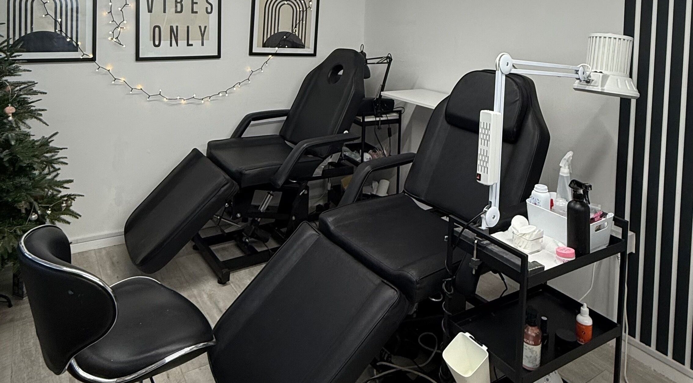 Relaxing treatment room at Point G, London, England, GB featuring plush chairs and soothing decor.