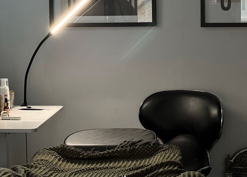 Relaxing corner at Point G, London, England, GB with a cozy chair and ambient lighting.