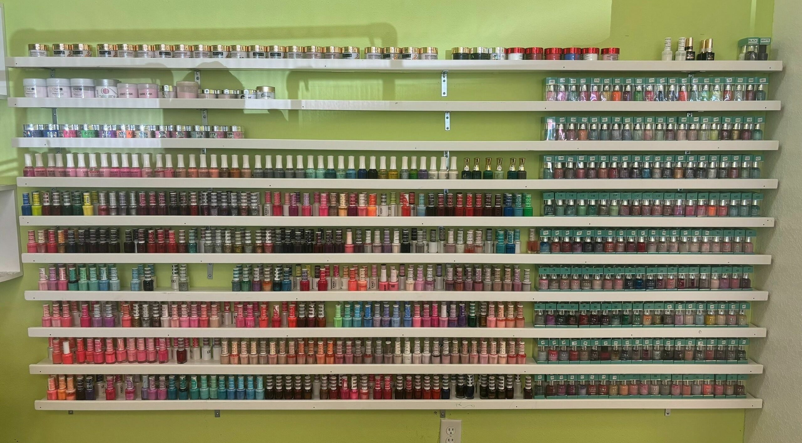Extensive nail polish collection at Great Professional TA Nails, Beaverton, Oregon, US.