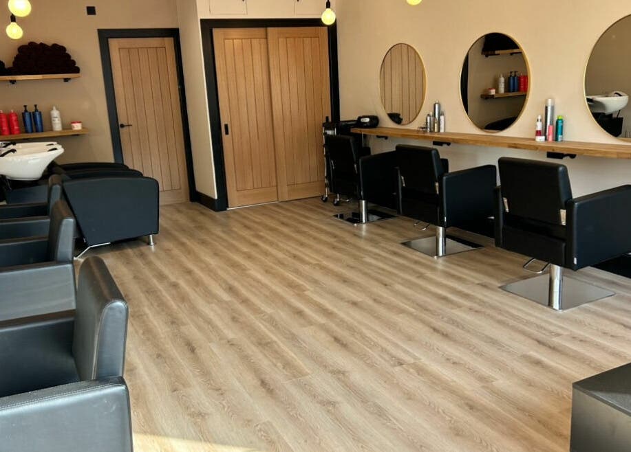 Lamafi Hair Studio in Edinburgh, Scotland, GB features stylish chairs, mirrors and modern decor.