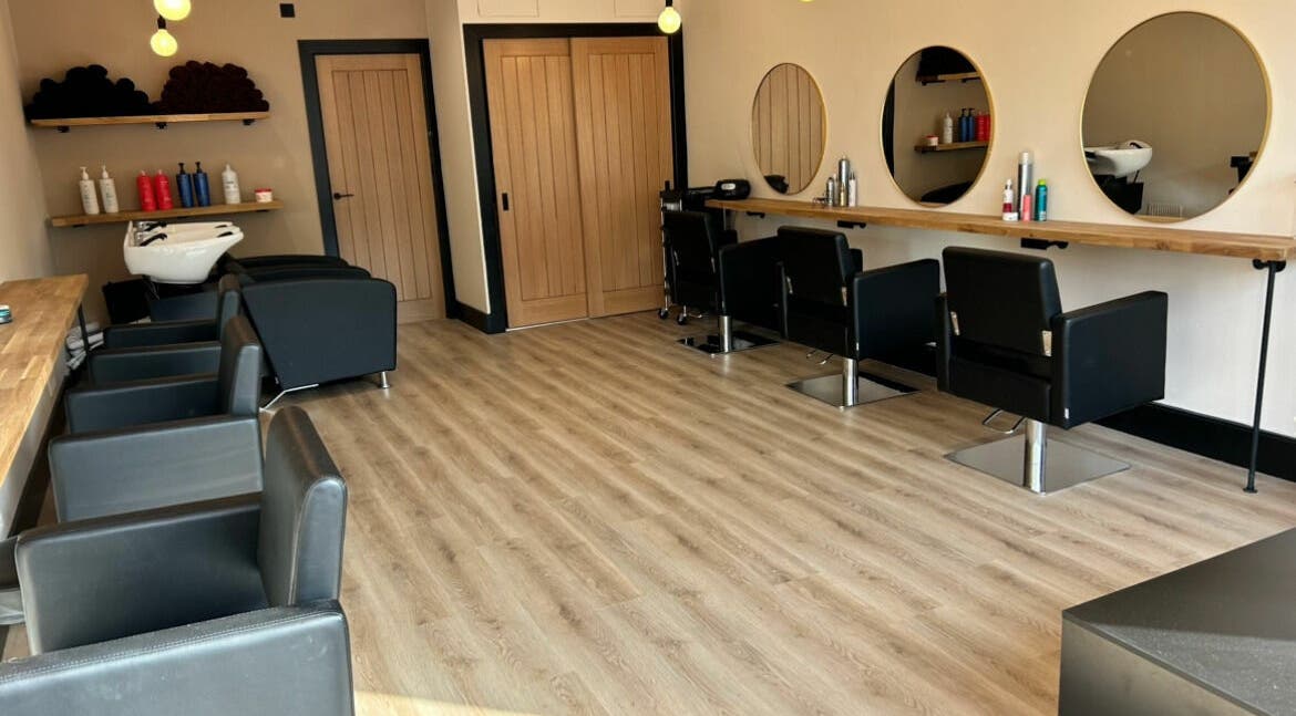 Lamafi Hair Studio in Edinburgh, Scotland, GB features stylish chairs, mirrors and modern decor.