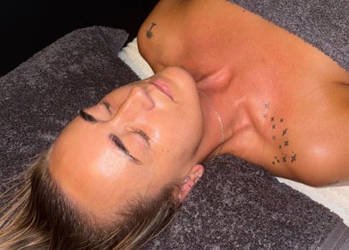 Person relaxing at Vs Skin spa in Glasgow, Scotland, GB, enveloped in a calming ambiance.