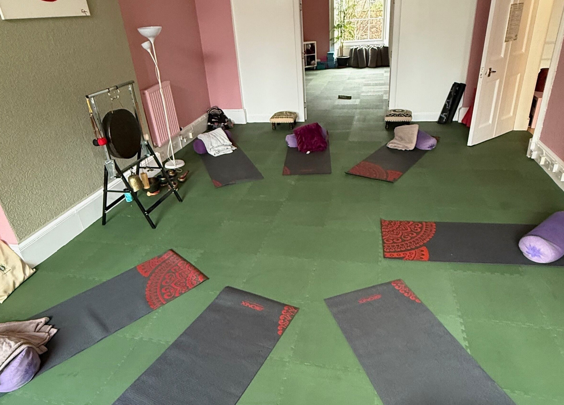 Yoga mats in a peaceful room at OMH Wellness Studio, Edinburgh, Scotland, GB, set for relaxation.