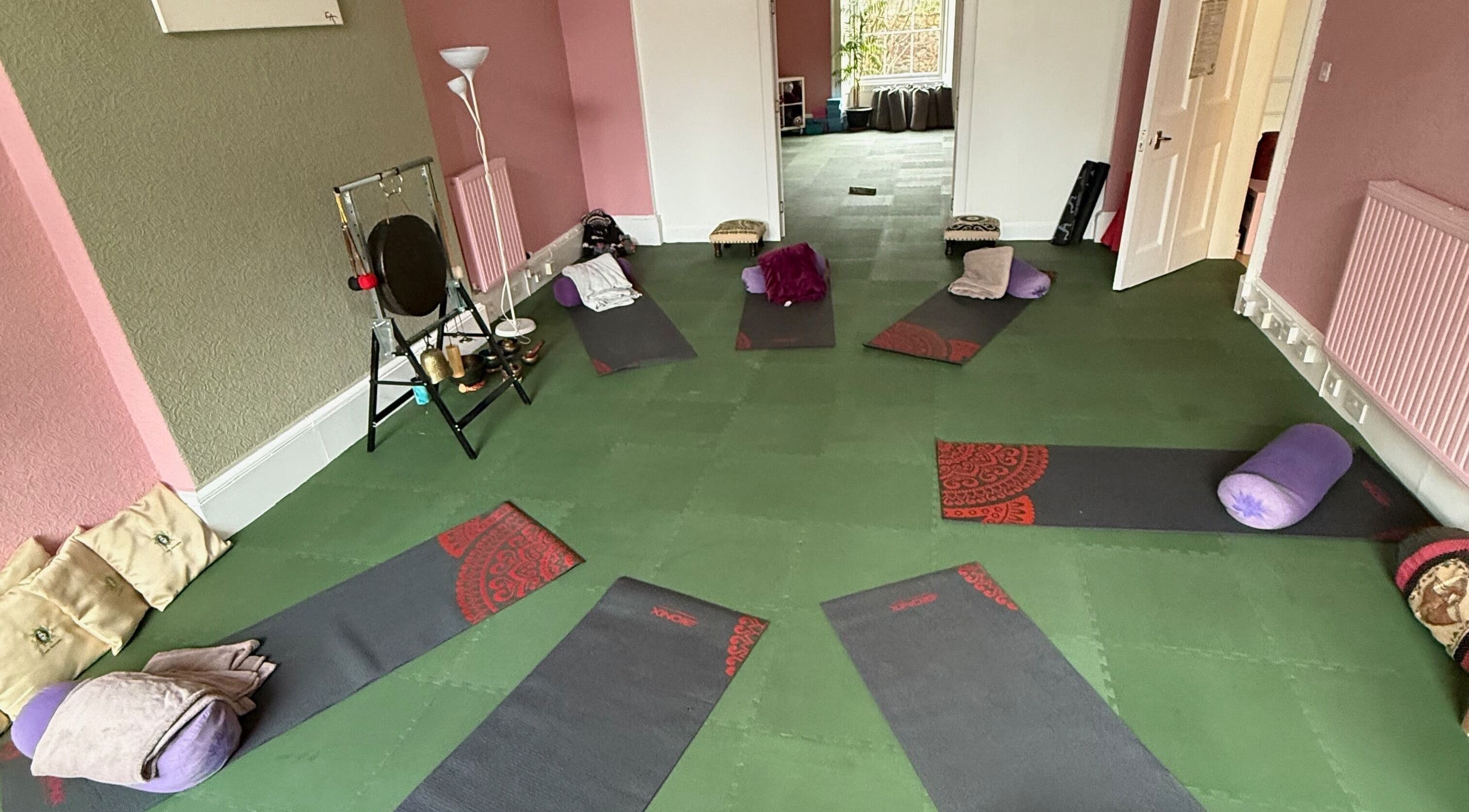 Yoga mats in a peaceful room at OMH Wellness Studio, Edinburgh, Scotland, GB, set for relaxation.