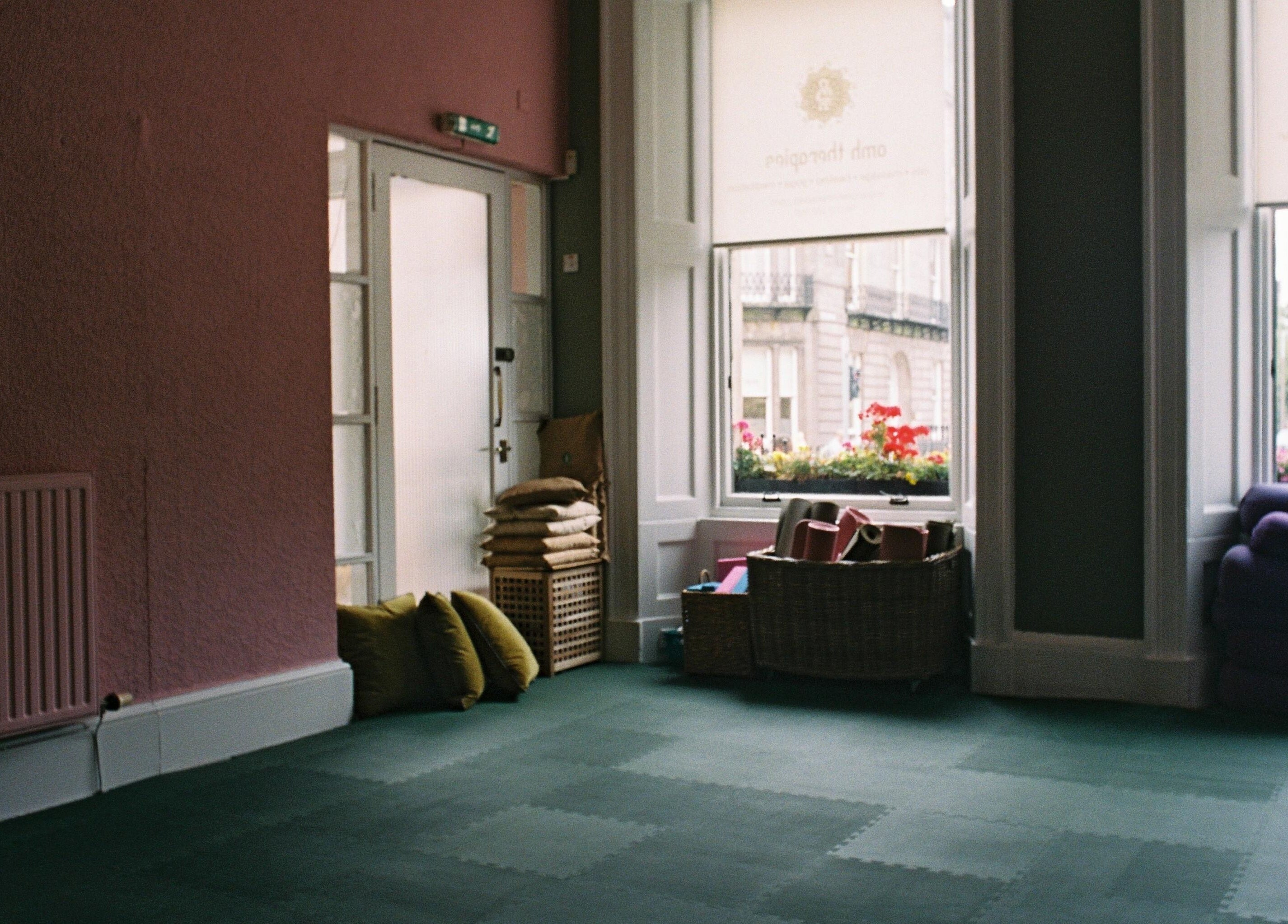 Spacious yoga room with cushions at OMH Wellness Studio, Edinburgh, Scotland, GB.