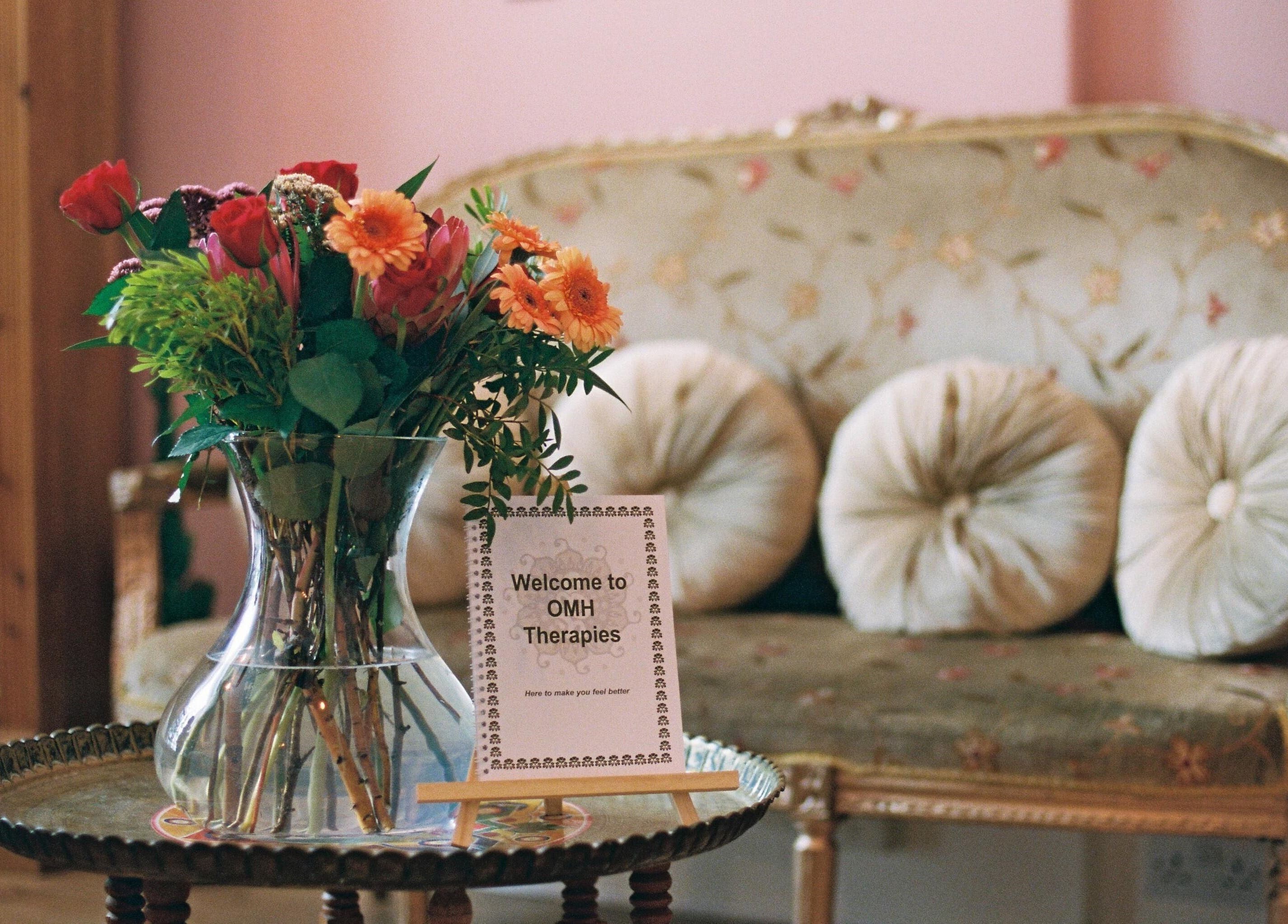 OMH Wellness Studio's welcoming nook with plush seating and floral decor in Edinburgh, Scotland, GB.