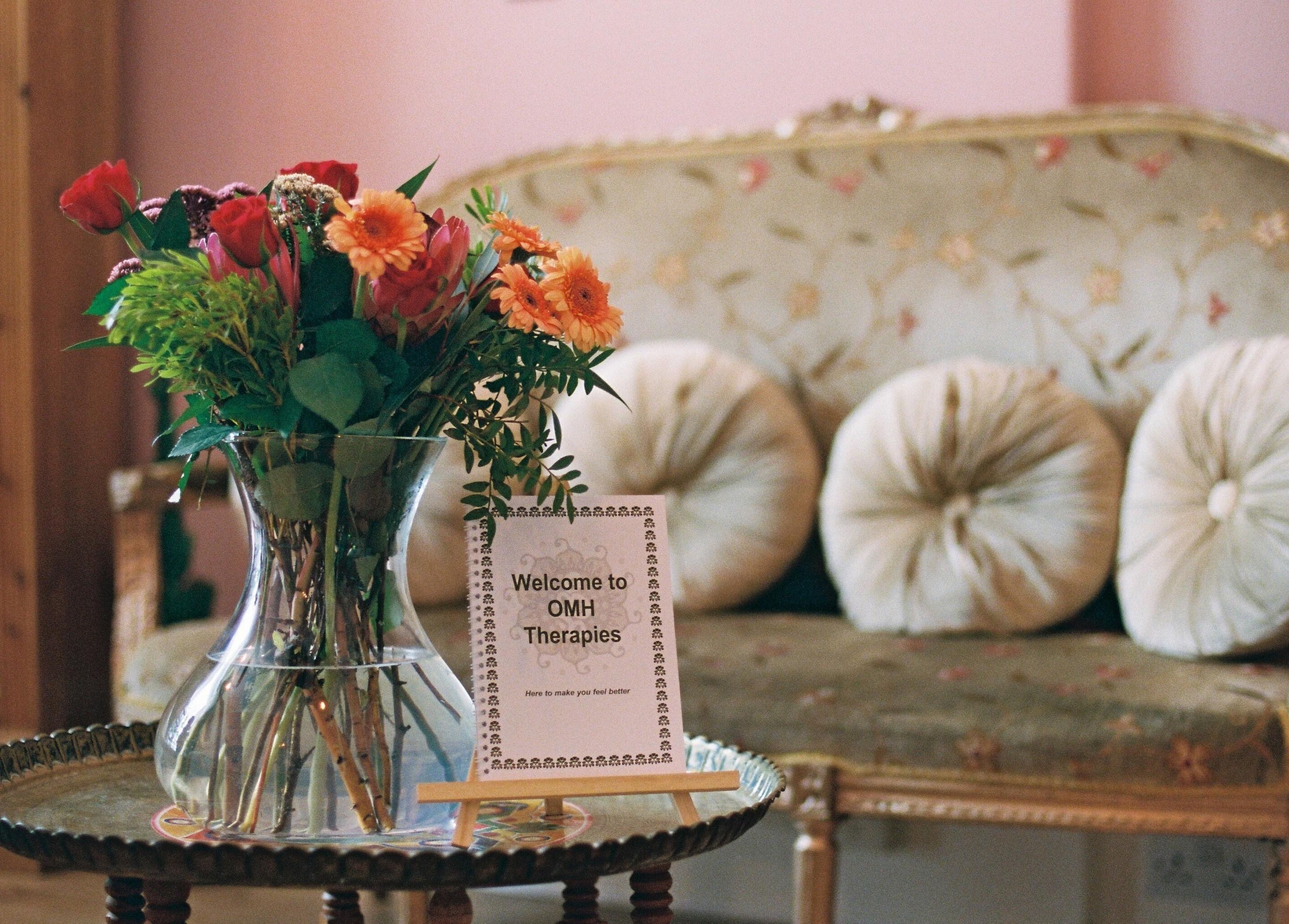 OMH Wellness Studio's welcoming nook with plush seating and floral decor in Edinburgh, Scotland, GB.