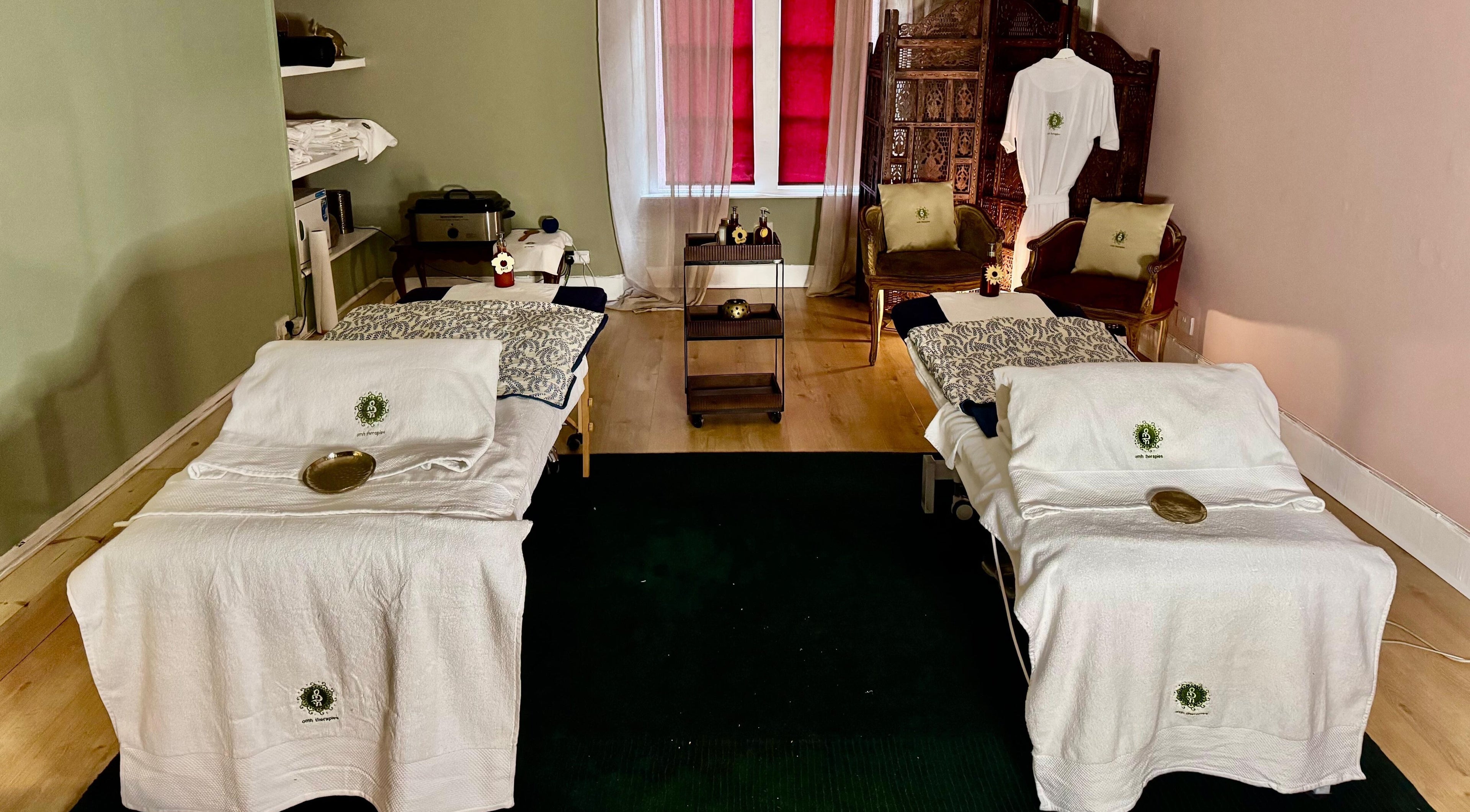 Peaceful therapy room at OMH Therapies Yoga & Meditation Studio Edinburgh, Edinburgh, Scotland, GB with massage tables.