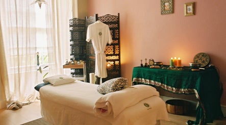 Relaxing therapy room at OMH Therapies Yoga & Meditation Studio Edinburgh, Edinburgh, Scotland, GB, with candles and a massage table.