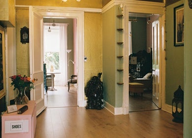 Elegant hallway at OMH Therapies Yoga & Meditation Studio Edinburgh, Scotland, GB with light-filled rooms.