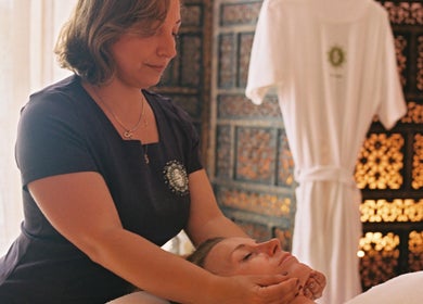 Therapist performing a calming face massage at OMH Therapies Yoga & Meditation Studio Edinburgh, Edinburgh, Scotland, GB.