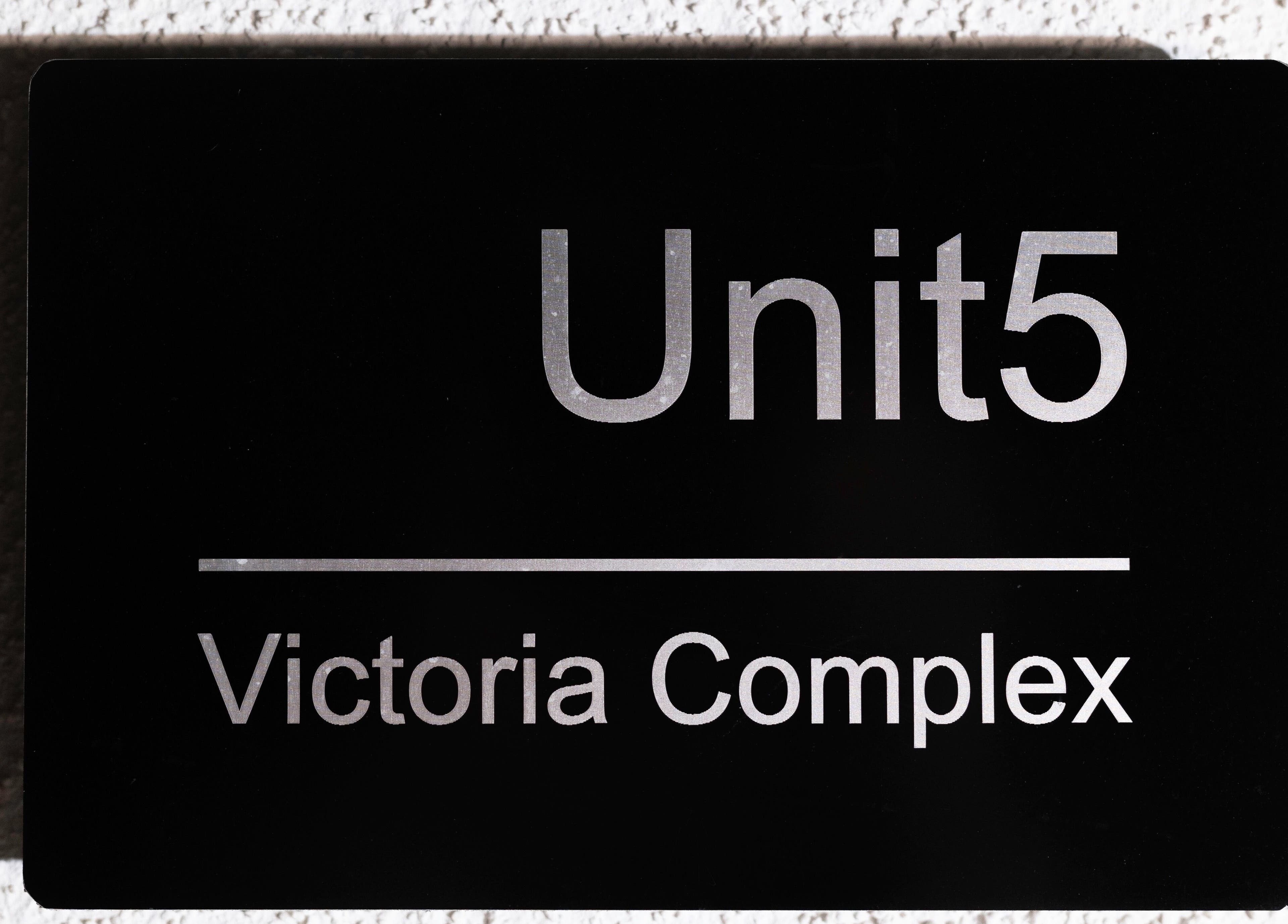 Black sign reading 'Unit5 Victoria Complex' at Glow Club, Skegness, GB.
