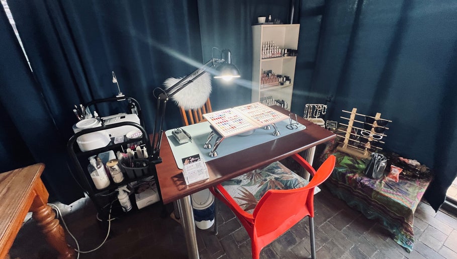 Nail art station at Kara Beauty in Cape Town, Western Cape, ZA, showcasing tools and polish options.