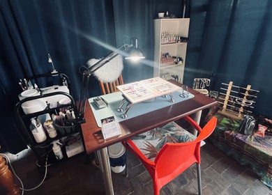 Nail art station at Kara Beauty in Cape Town, Western Cape, ZA, showcasing tools and polish options.