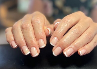 Elegant French manicure at Kara Beauty, Cape Town, Western Cape, ZA, featuring classic white nail tips.