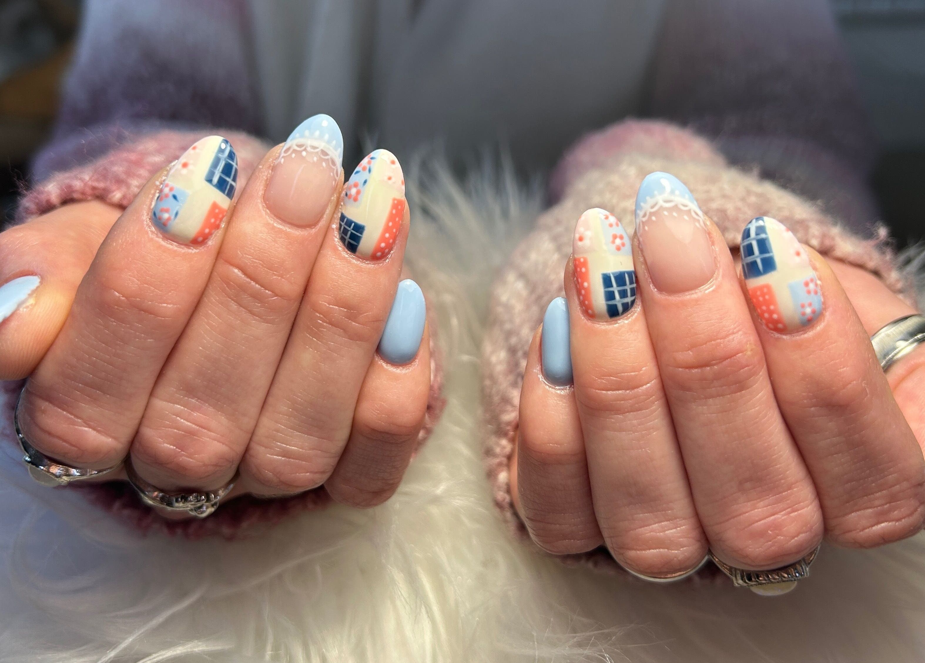 Creative nail art with blue patterns at Kara Beauty, Cape Town, Western Cape, ZA.