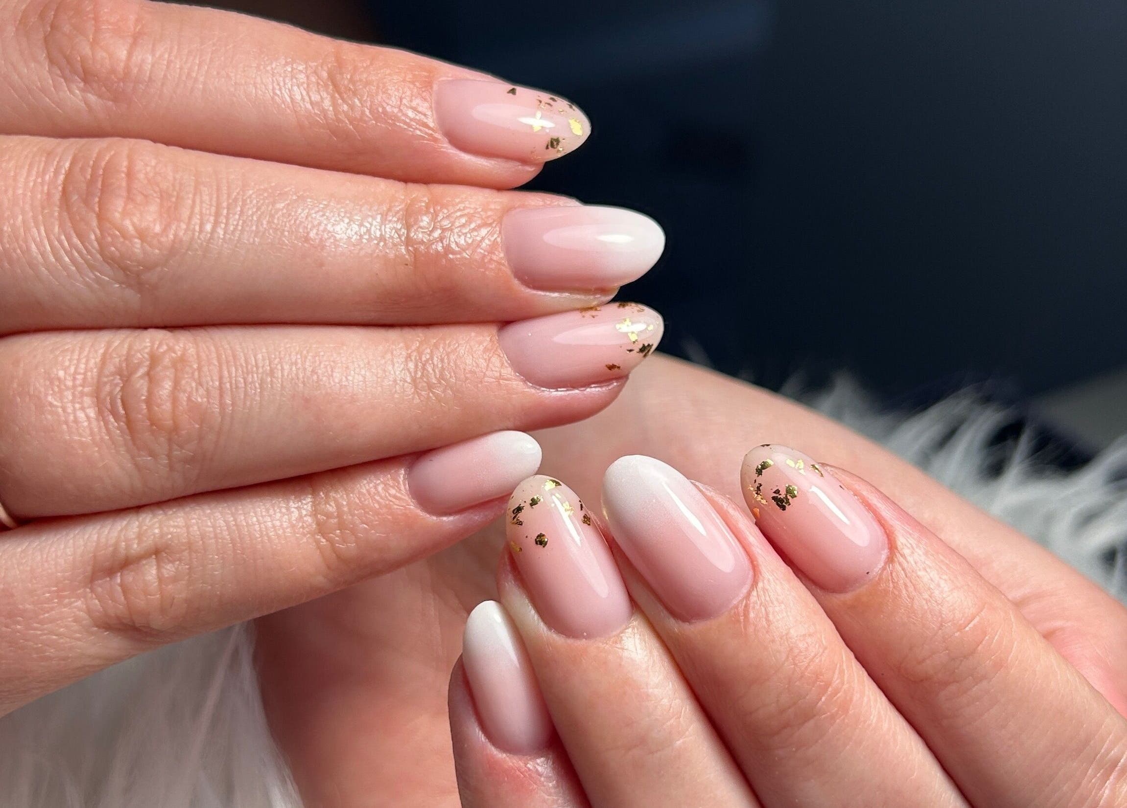 Elegant manicured nails with gold accents at Kara Beauty, Cape Town, Western Cape, ZA.
