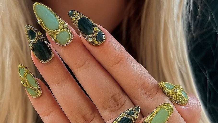 Unique gemstone nail art at Evergreen Beauty in Desborough, England, GB showcasing intricate designs.