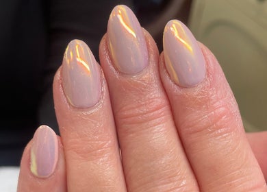 Close-up of beautifully manicured nails at Evergreen Beauty in Desborough, England, GB, with an iridescent finish.
