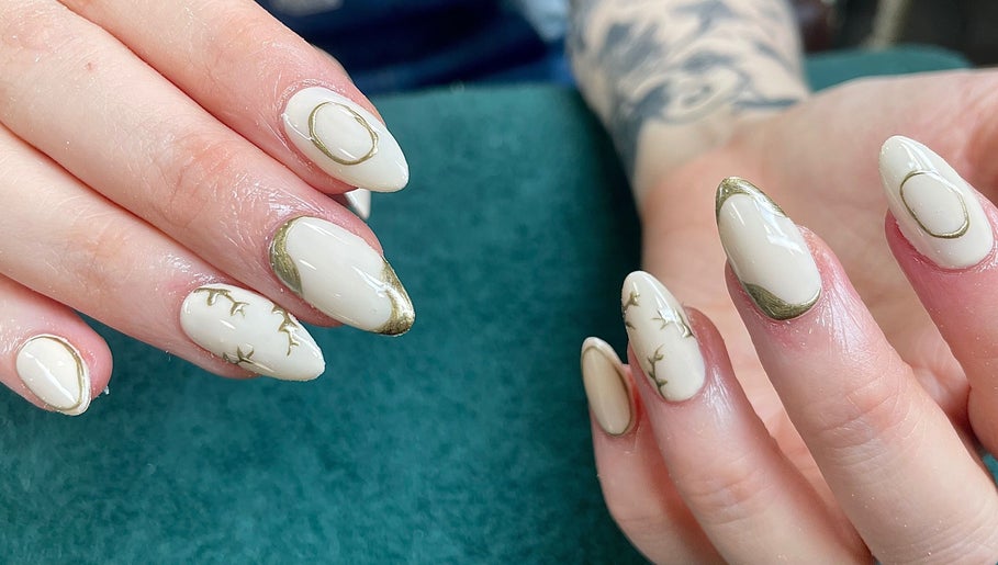 Intricate nail art with gold accents at Evergreen Beauty and Wellness, Desborough, England, GB.