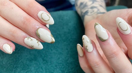 Intricate nail art with gold accents at Evergreen Beauty and Wellness, Desborough, England, GB.