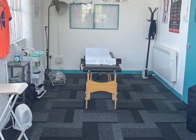 Bruprofitness Sports massage therapy room in Nottingham, England, GB, featuring massage table and calming decor.