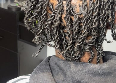 Close-up of stylish twisted hair at pmhairlounge, London, England, GB. Expertly styled natural curls.