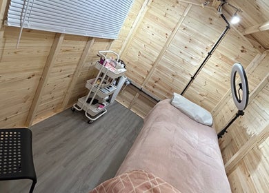 Tranquil lash treatment room at Get Lashed with Ab, Basildon, England, GB with a cozy bed and warm lighting.