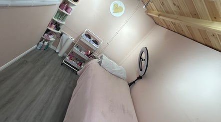 Inviting lash treatment room at Get Lashed With Ab in Basildon, England, GB featuring a comfy bed and beauty supplies.