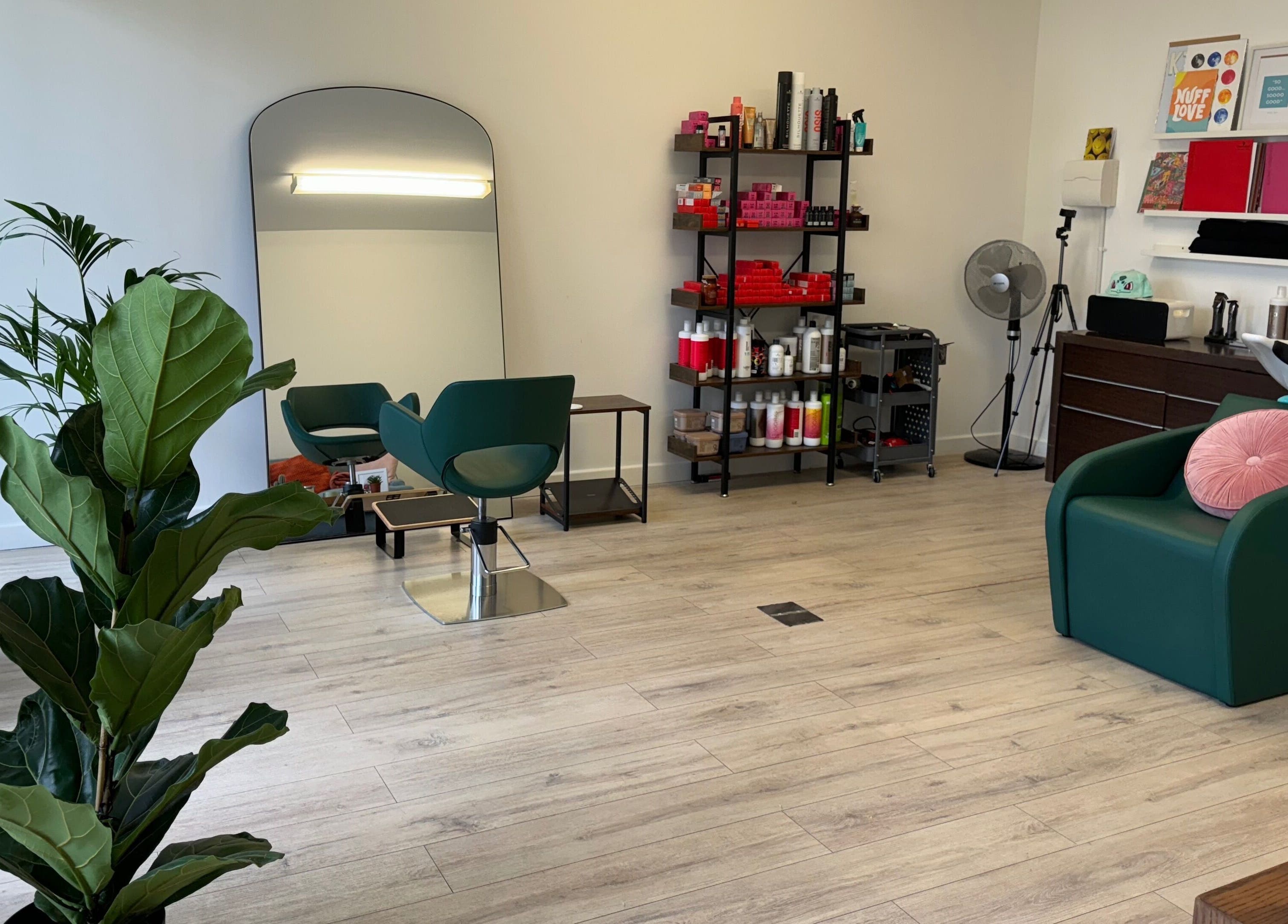 Interior of The Good Hair Studio in London, England, GB showcasing modern decor and styling stations.