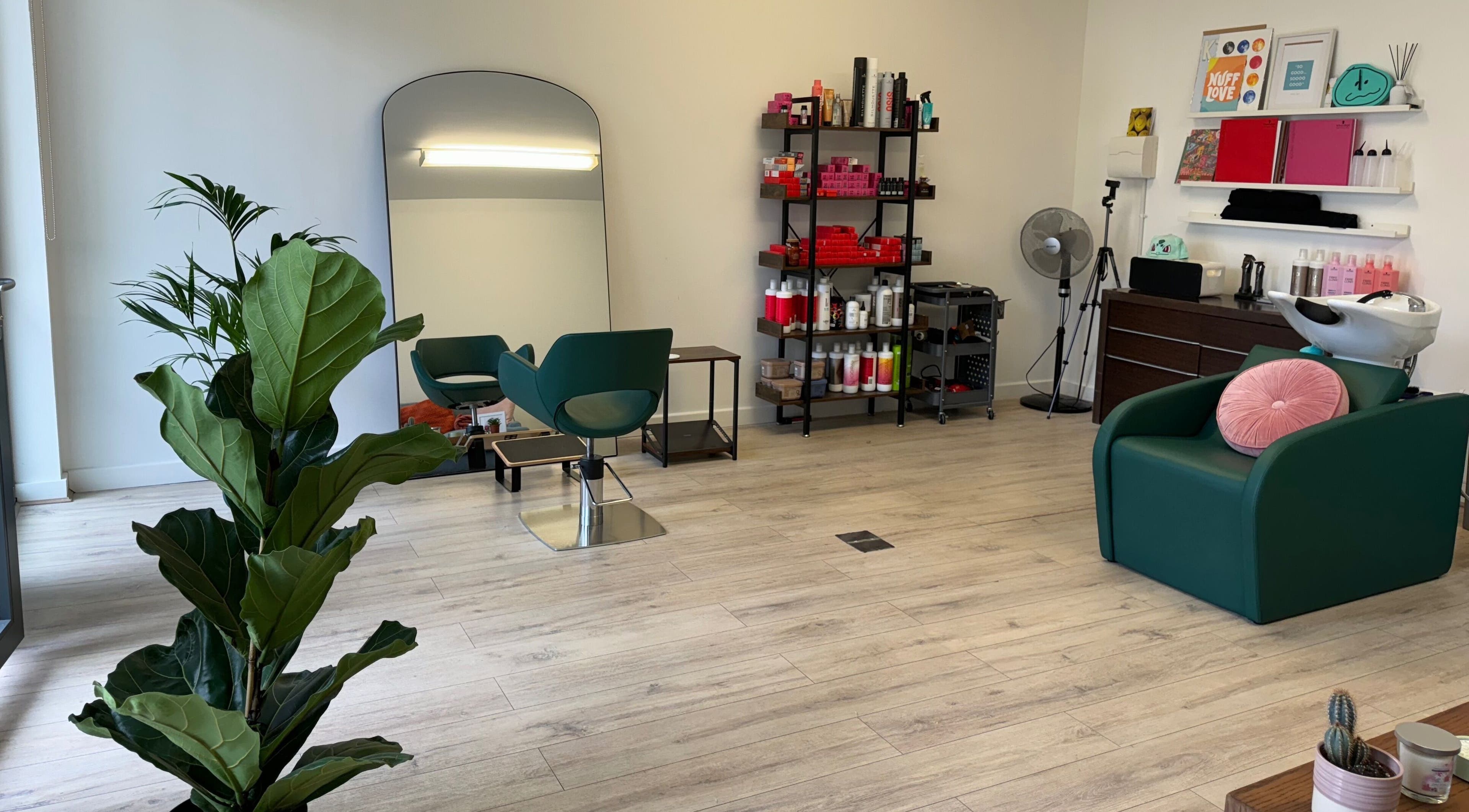 Interior of The Good Hair Studio in London, England, GB showcasing modern decor and styling stations.