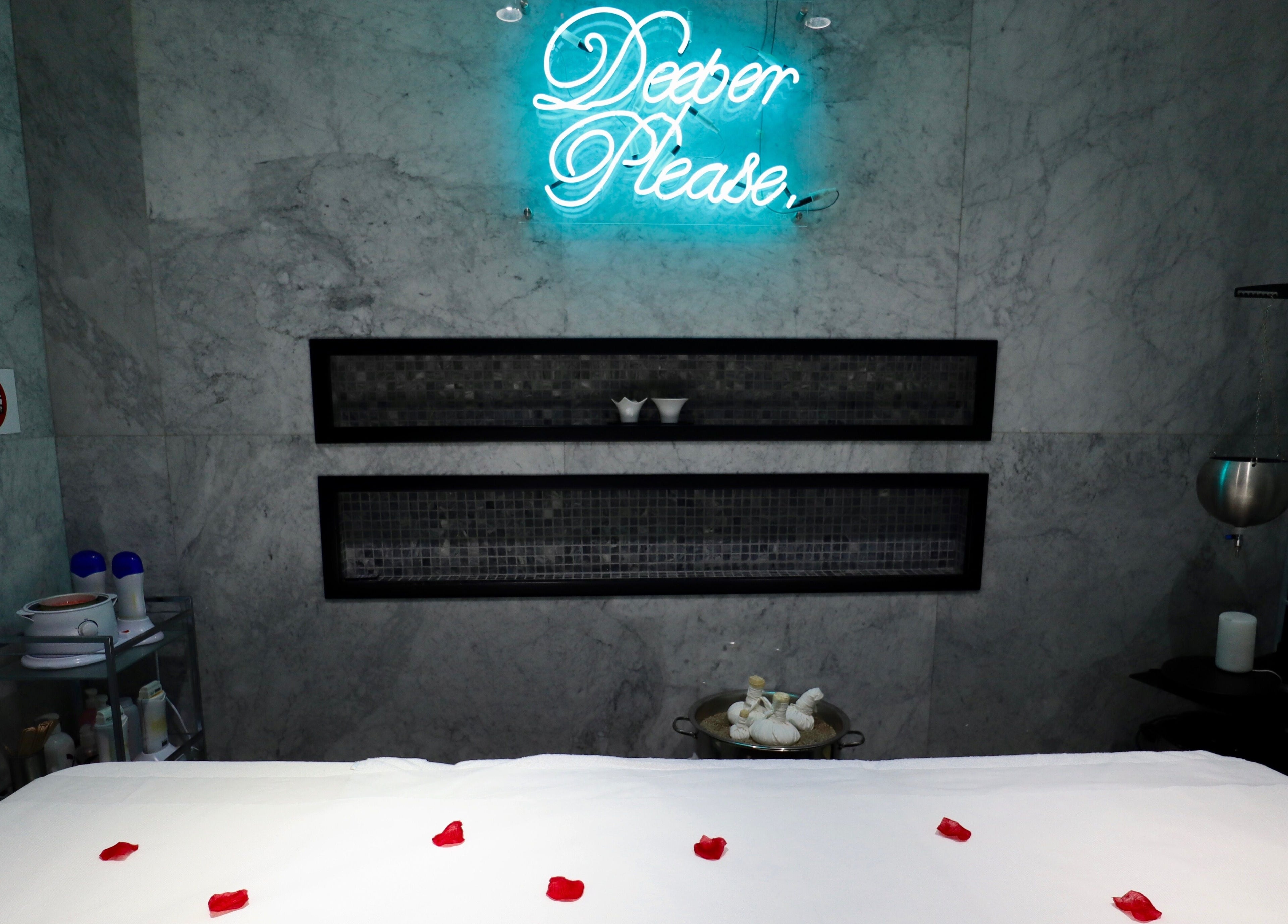 Luxurious spa room at The Nail Pavilion JLT, Dubai, Dubai, AE with calming decor and massage bed.