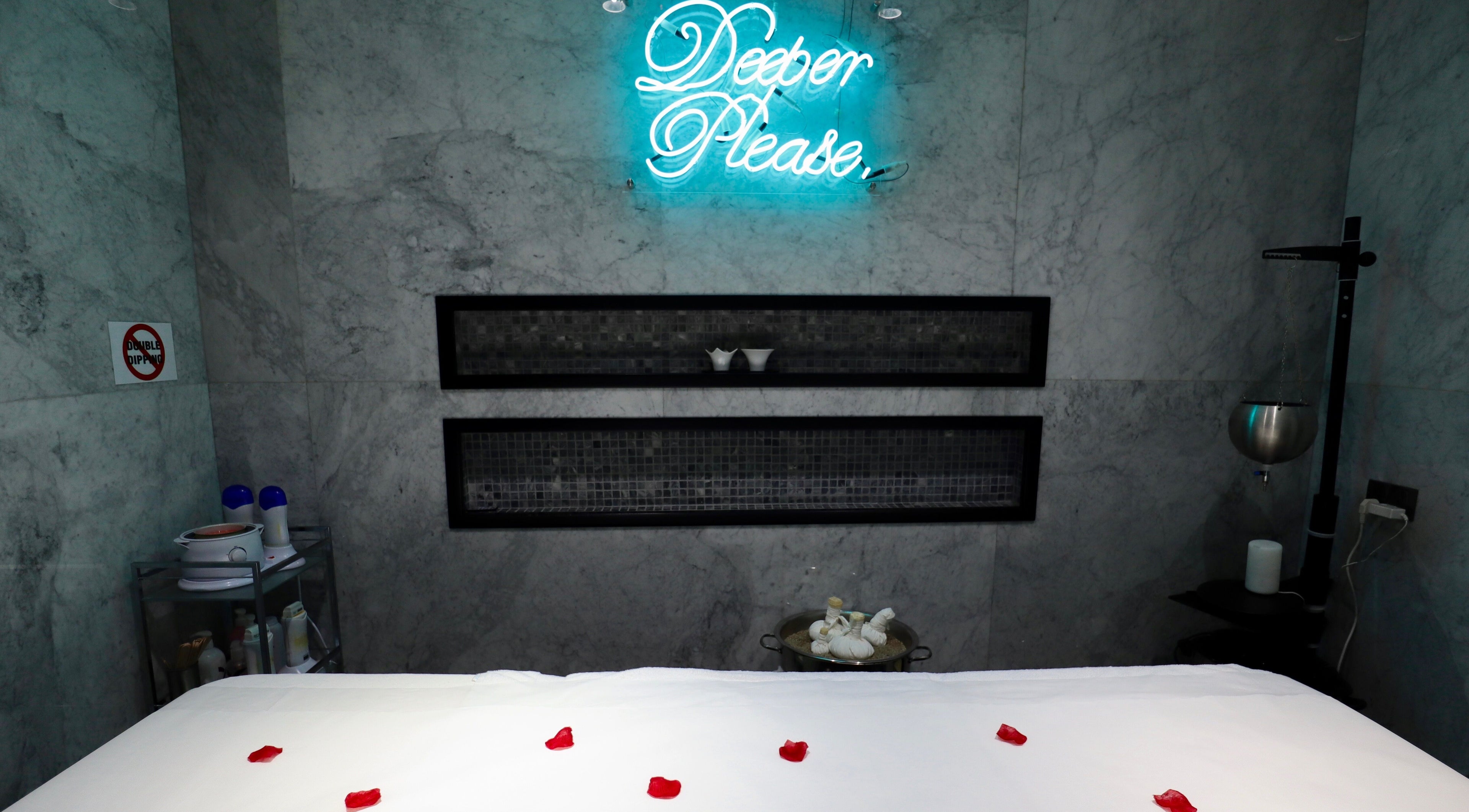 Luxurious spa room at The Nail Pavilion JLT, Dubai, Dubai, AE with calming decor and massage bed.