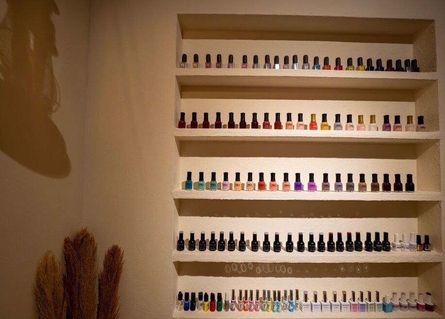 Colorful nail polish display at Hisma Spa, Riyadh, Riyadh Province, SA, showcasing diverse wellness options.