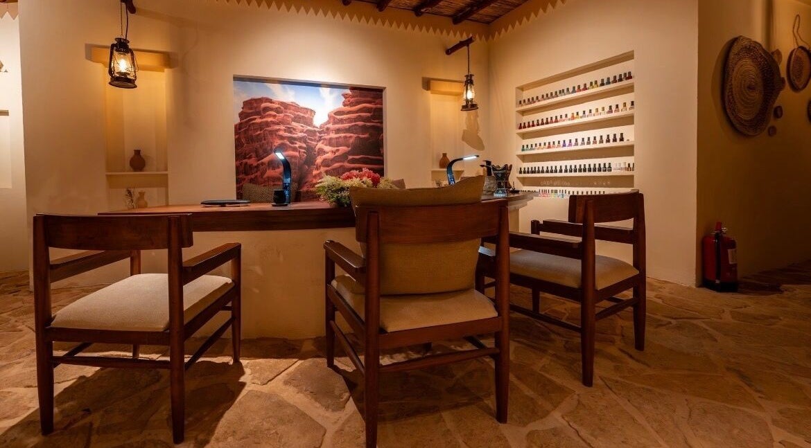 Serene interior at Hisma Spa, Riyadh with warm lighting and earthy decor for relaxation.